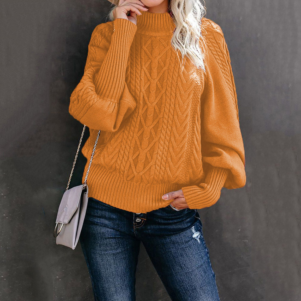 Women's chunky knit sweater with high collar and voluminous sleeves