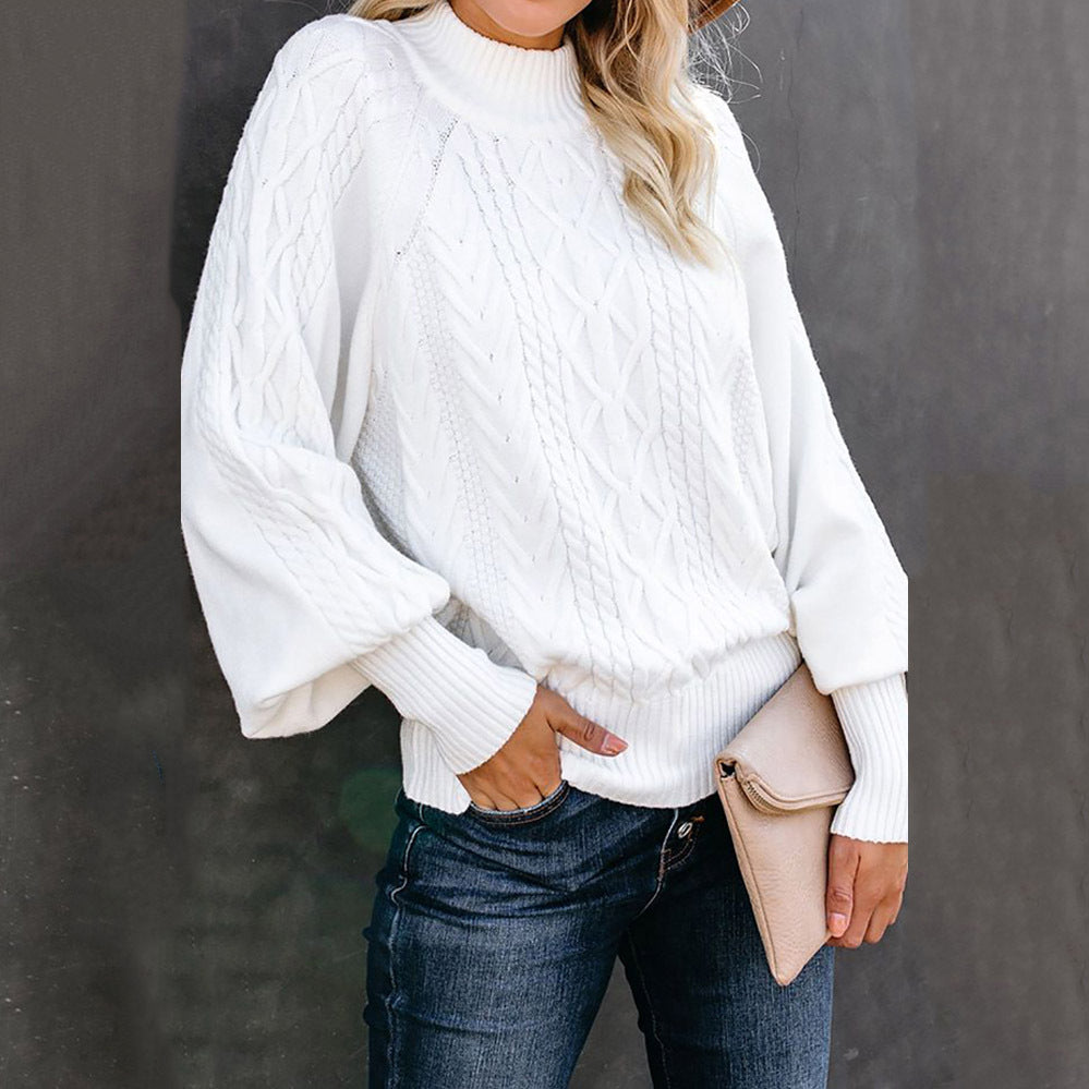 Women's chunky knit sweater with high collar and voluminous sleeves