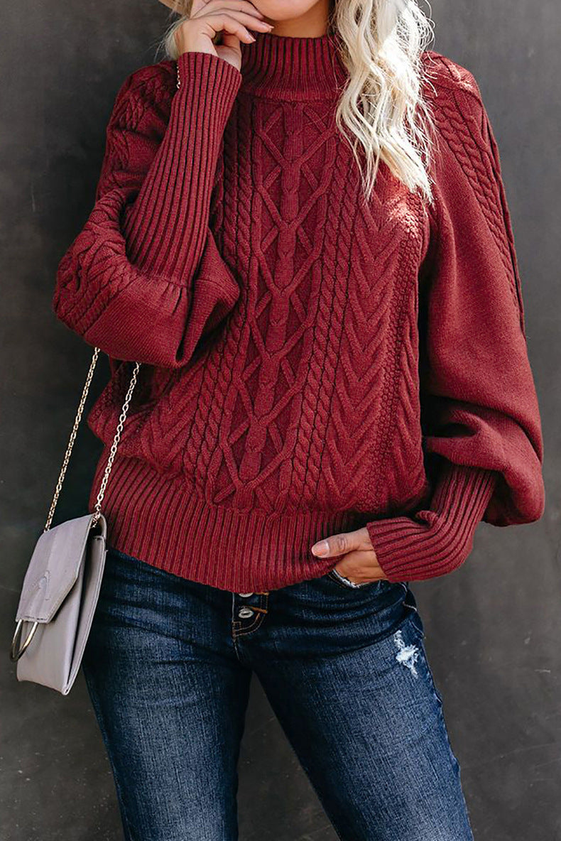 Women's chunky knit sweater with high collar and voluminous sleeves