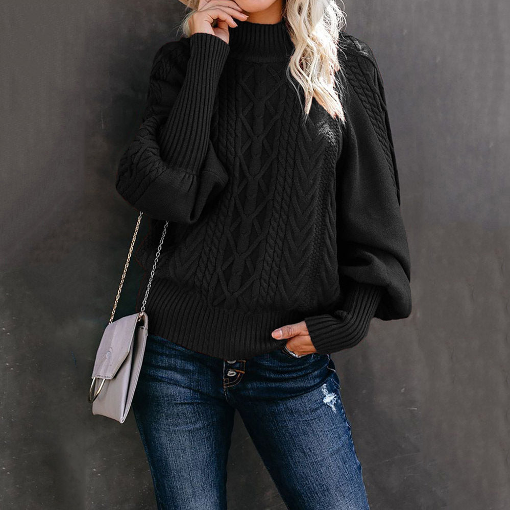 Women's chunky knit sweater with high collar and voluminous sleeves