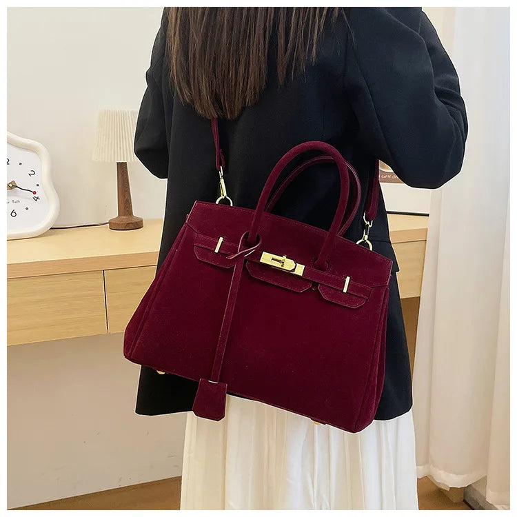 Kelly | Suede shoulder bag with gold hardware