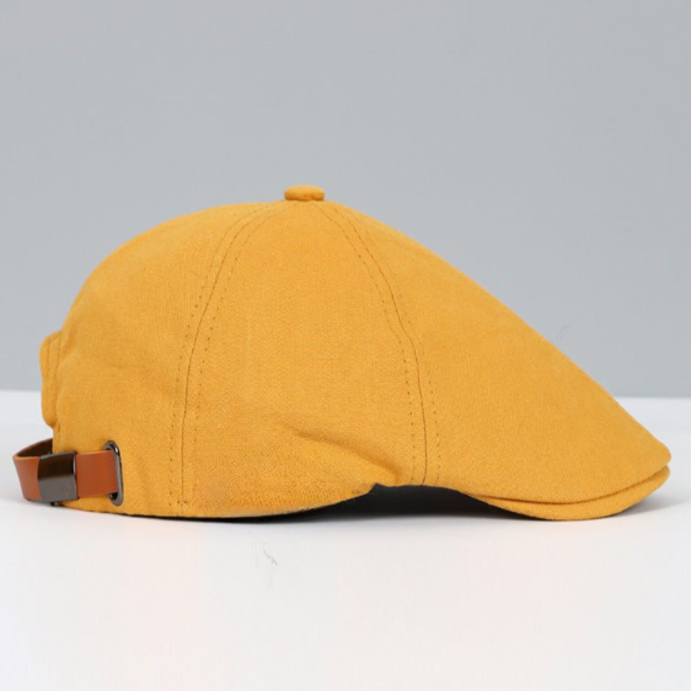 Unisex flat cap with curved flap and textured top