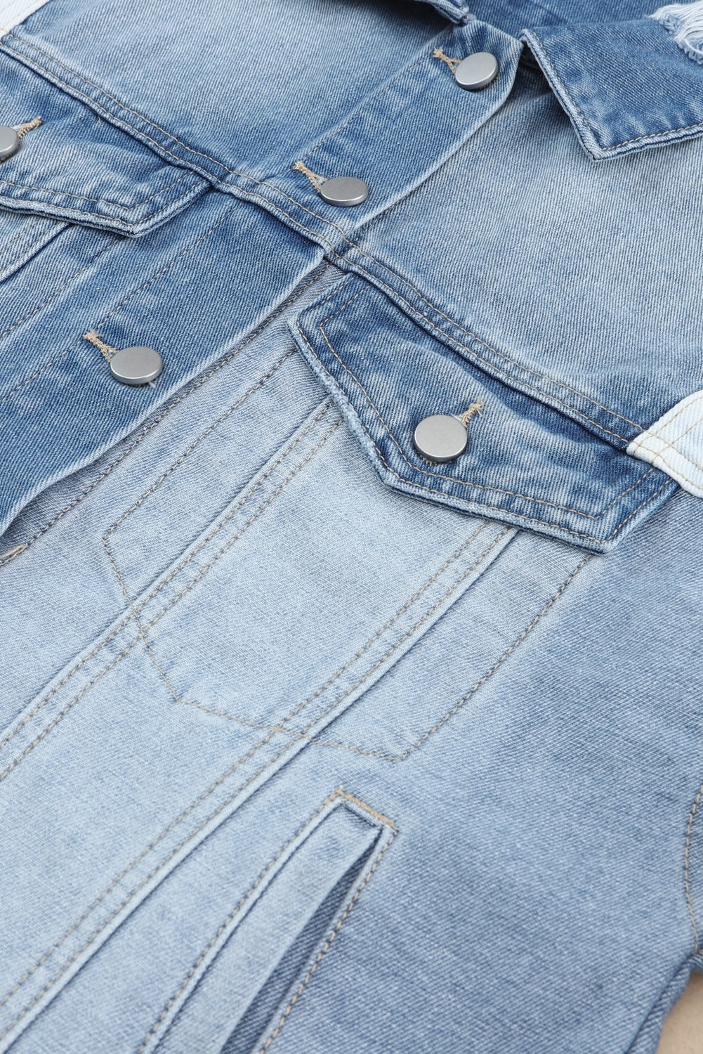 Stylish denim jacket with patchwork and frayed hem - Women