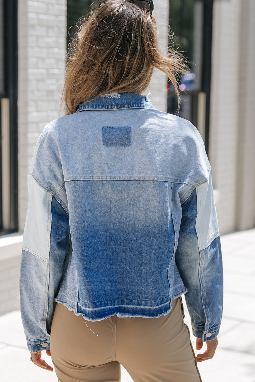 Stylish denim jacket with patchwork and frayed hem - Women