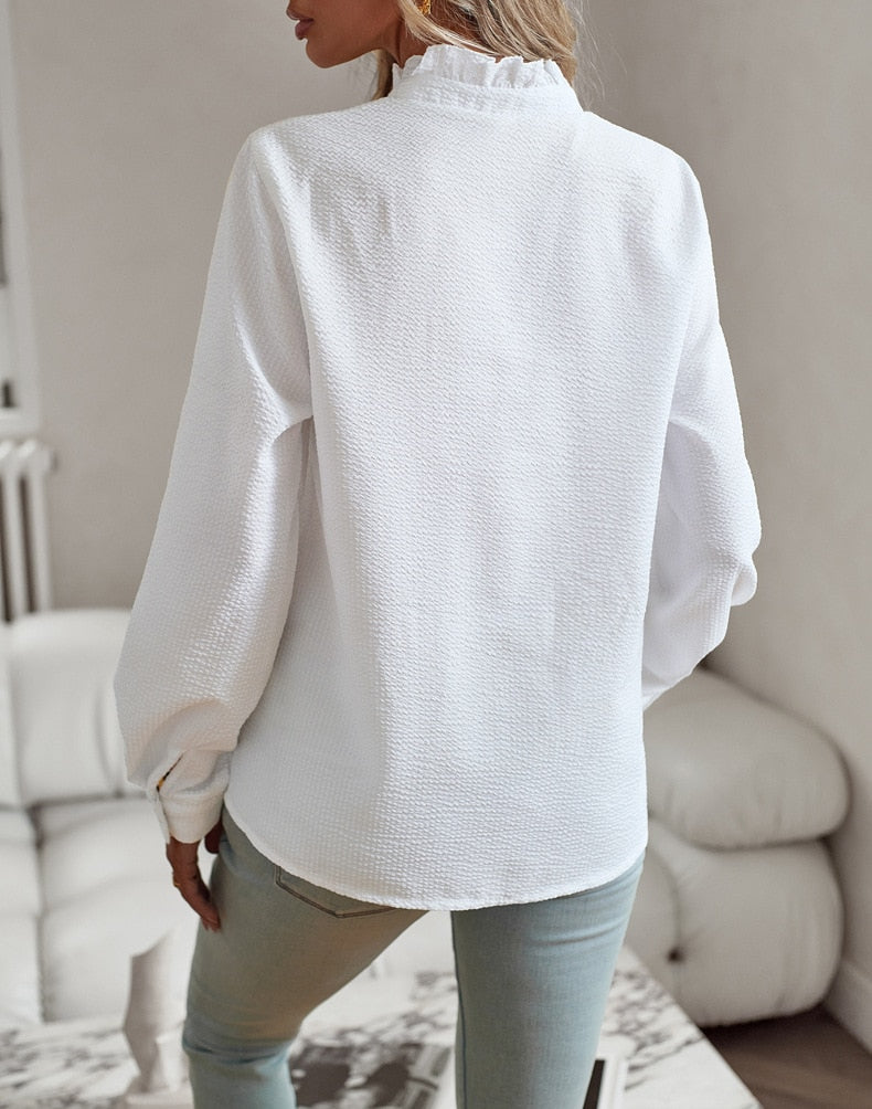 Elegant long-sleeved women's blouse with stand-up collar
