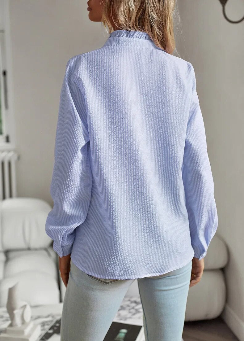 Elegant long-sleeved women's blouse with stand-up collar