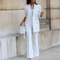 Elegant women's blazer with button fastening and flared trousers - two-piece set for every season