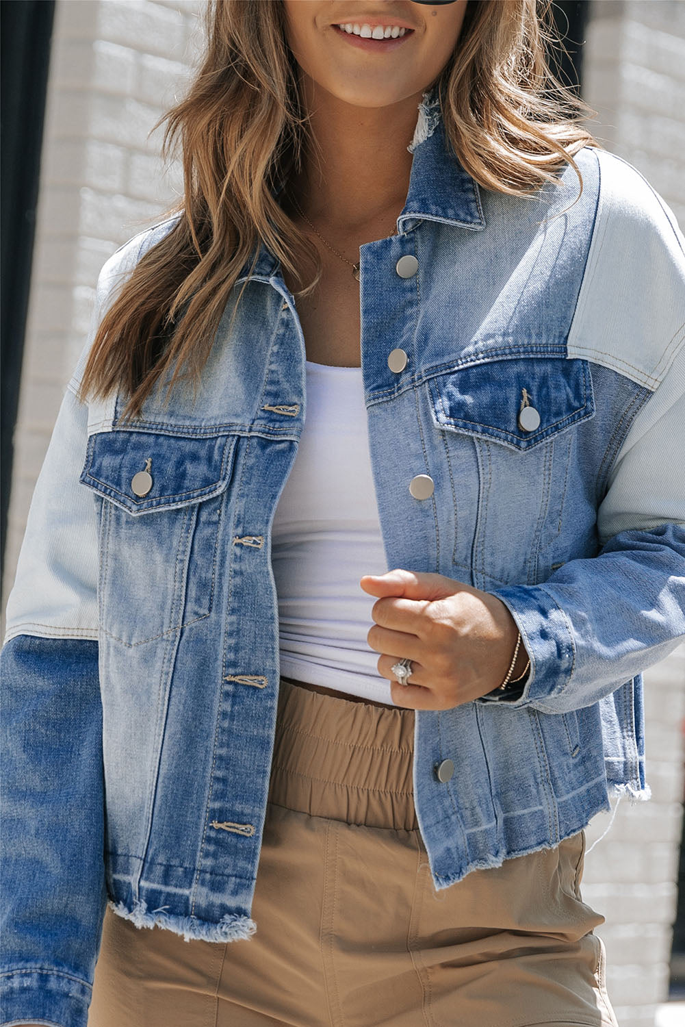 Stylish denim jacket with patchwork and frayed hem - Women