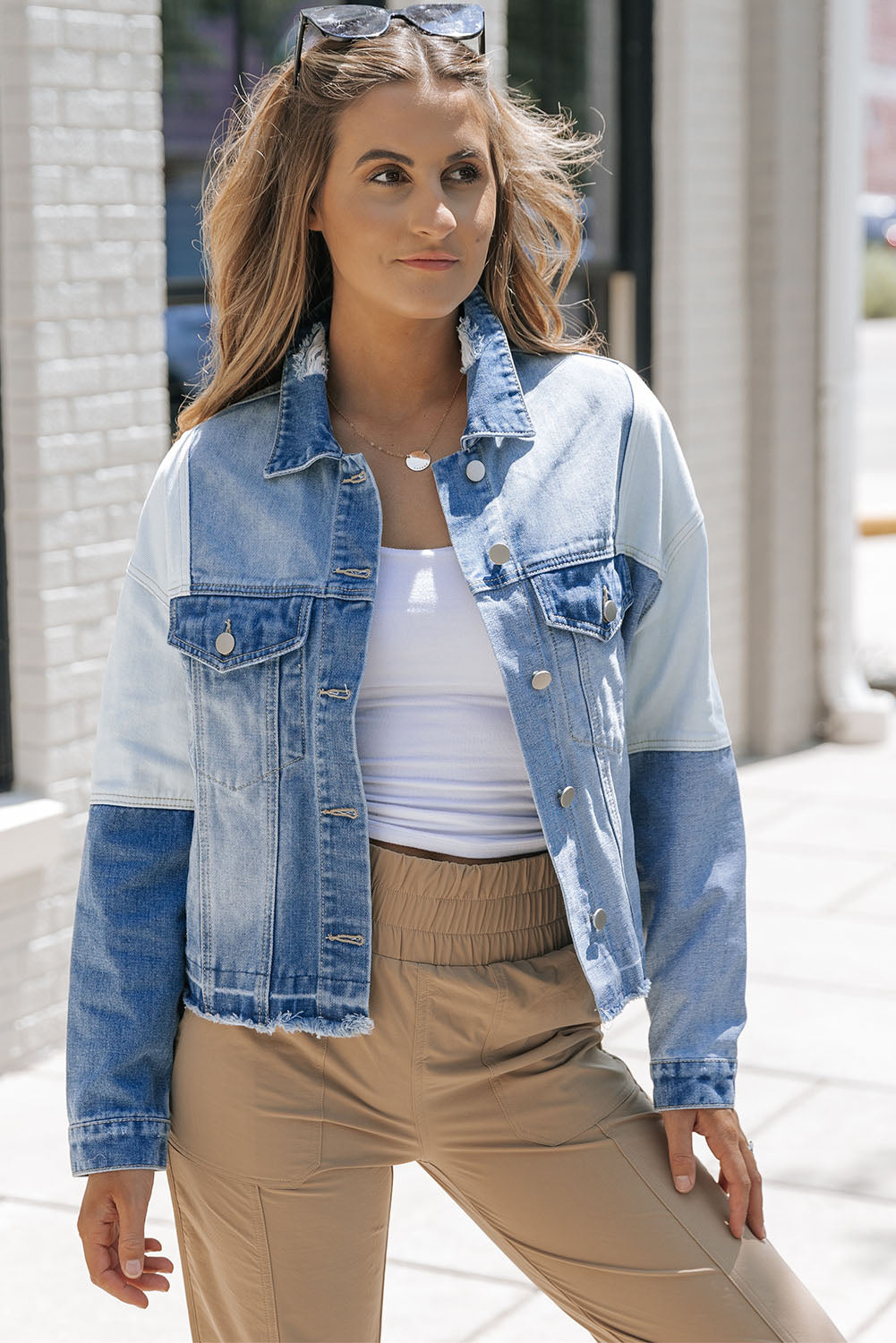 Stylish denim jacket with patchwork and frayed hem - Women