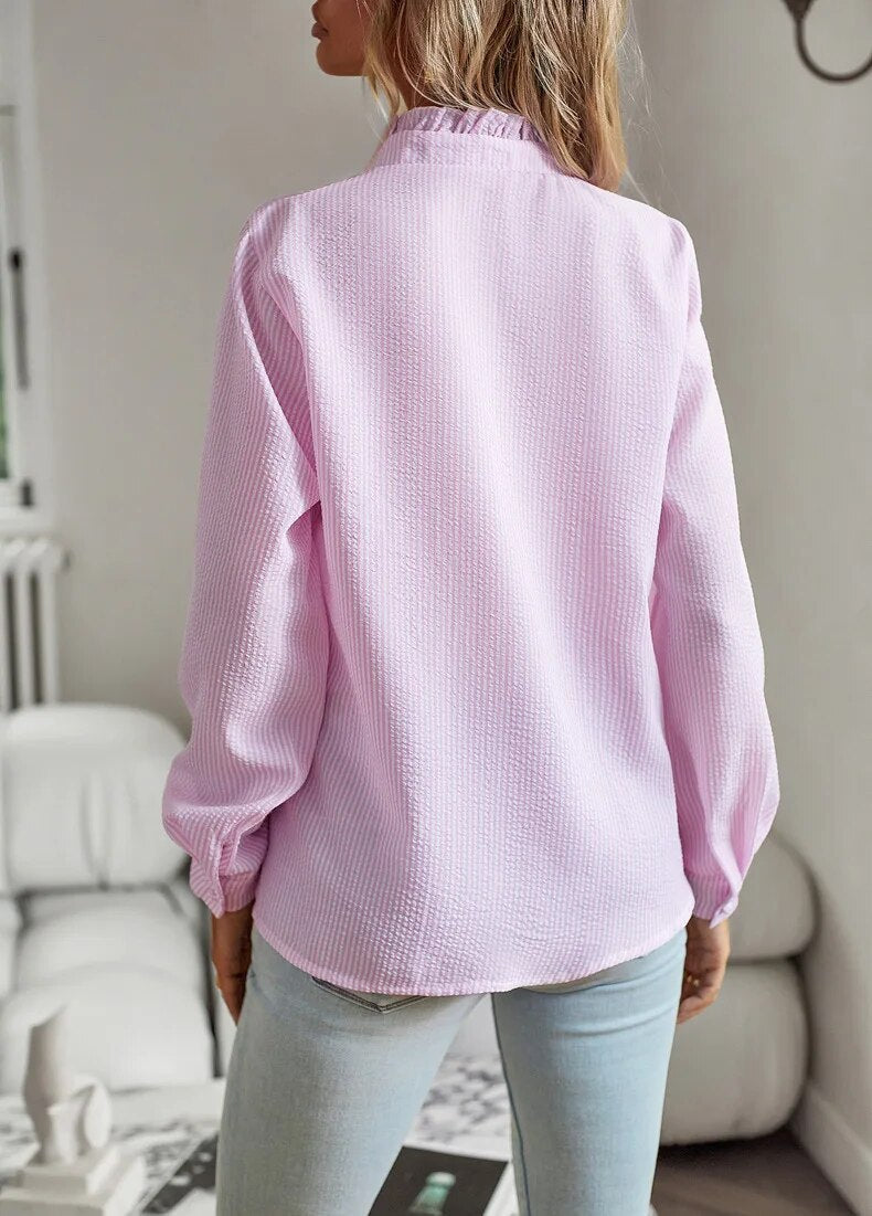 Elegant long-sleeved women's blouse with stand-up collar